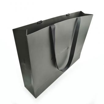 Black paper gift bag with ribbon handle